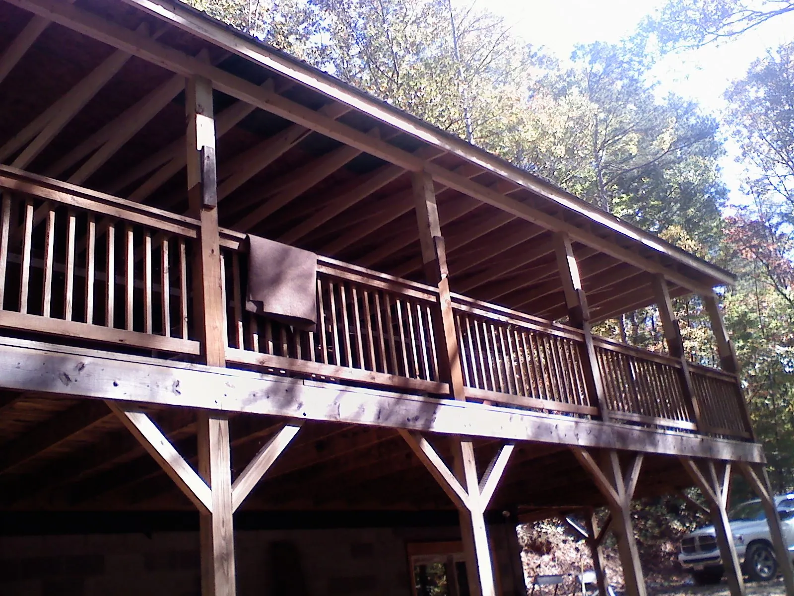 Timber framing under a new elevated porch and deck — Roof Leak Repair in Crested Butte by Roofing Brothers